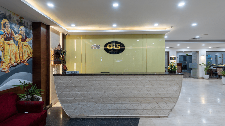 Front reception area with air-conditioning and paintings on the side at DLS The Classio